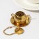 Goldie tea, kettle, gold color