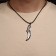 Piece of men's "knife", color black silver on a black lace, 45 cm