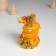 Polystone souvenir "Orange snakes with flowers on coins" 6x5.8x8.8 cm