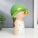 Souvenir Polystone "Baby in a green hat, with a gold bubble" Green peas 26x15x18 cm