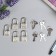 A hinged metal lock for caskets with a key of 3.3x1.9 cm