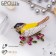 Brooch "Bird Sinichka", colored yellow in gold