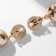 Clips "Busina", white color in gold