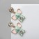 Emall earrings "Elephants" with hearts, colored in silver
