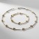 Set 2 objects “necklaces, bracelet” Noel discs, white color in gold
