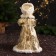 Snow Maiden "In a clutch with fur bombs" 33 cm, golden-white