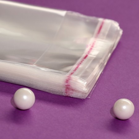 BOPP package with adhesive valve, transparent 10 x 18/4 cm, 25 μm-2