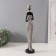 Polystone souvenir "African in a dress with leaves, with a pot" White with black 8.5x8x39 cm