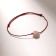 Bracelet of desires "Pink" on the burgundy thread, the length is regulated