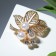 Brooch "Pearl shine" Color white in gold