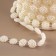 Pearls on threads, flat, 10 mm, 9 ± 1 m, milk color