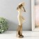 Polystone souvenir "Girl in a wide -brimmed hat. Wind" Sand with bronze 12.5x9.5x31 cm