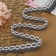 Knitted lace, 20 mm × 2.7 ± 0.5 m, white/gray color