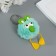 Fluffy on the ring "Bright -eyed raven" Green 9.5x6x6 cm