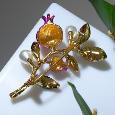 Brooch "Grenade branch", color in gold-1