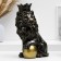 The piggy bank "Leo with a crown and a ball sits" black with gilding, 23cm