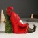 Souvenir Polystone Light "Santa Claus in a red outfit sits at the Christmas tree" 14x7x18 cm