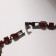 Bracelet with rhinestones "ice" stream, red color in gray metal, 18 cm