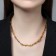 The necklace "wire" is prickly, the color is gold, l = 45 cm