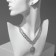 Set 4 objects: earrings, necklaces, bracelet, ring "grace" circles, white color in silver