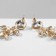 Hanging earrings with rhinestones "bun" deciduous, white color in gold, 9.5 cm