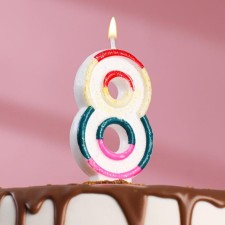 A candle for a cake with sparkles 