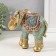 Souvenir Polystone "Elephant, chamomile on the Propon" red-blue, sparkle 15x6x12.5 cm