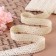 Knitted lace, 20 mm × 10 ± 1 m, beige color