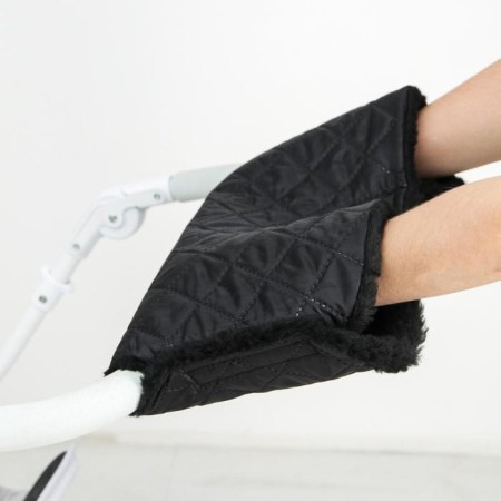 The coupling on the handle of the stroller, quilted, black color