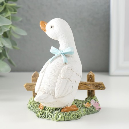 Polystone souvenir "Gusenok with a blue bow at the fence" 9x8x10 cm-1
