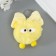 Fluffy on the ring "Masya with a large bow" yellow 12x8x8 cm