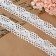 Knitted lace, 26 mm × 10 ± 1 m, white color