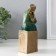 Souvenir Polystone "Girl in a sea wave dress sits in a cube" Bronze 7.5x7x16 cm