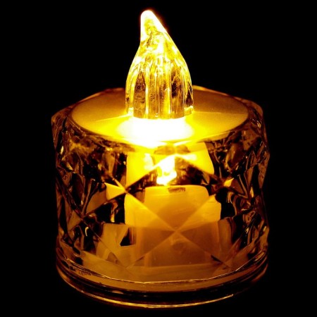 The candle is LED, burning yellow-3