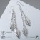 Earrings hanging "leaves" on chains, color silver, 7 cm