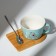 Ceramic mug on a stand with a spoon "Bear", 230 ml, beige color