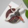 Brooch "Crane" soaring over the sea, colored in gold