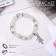 Bracelet Assorted "Bead" ballerina, white color in silver, d = 6 cm