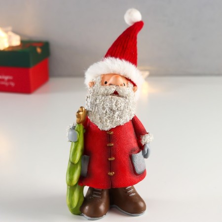 Souvenir Polystone "Santa Claus in red, with a curly beard with a Christmas tree" 15x6x8 cm