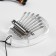 Kalim "pebbles" Music Life, 8 reeds, 7 x 5 x 1.8 cm, acrylic glass