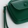 Lightning purse on a zipper, green color