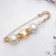 Pin "Cube" 6.5cm, white-brown color in gold