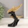 Polystone souvenir "Three dolphins on the wave, with patterns" gold 14x7x17.5 cm