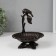 Souvenir cast iron stand "Bird on a branch above the flower" 17x15x13.5 cm