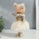 Interior doll "Baby in a beige outfit, a skirt from a mesh" 33x15x18.5 cm