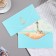 The envelope for money "ship" is blue background, 9x17 cm