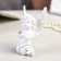 Suvenir Polystone "A Snowthrough Angel with a ball of rhinestones sits" mix 8x6x2.5 cm