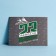 Congratulatory card "Since February 23!" real hero, gray background, 8 x 6 cm