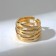The ring "links" is wide, the color is gold, dimensionless