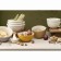 A set of 4 pyal cream/beige flowers with a relief pattern of the Taiga berries,